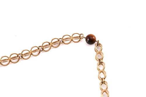 Lot 64 - A cage link necklace with tiger's eye bead...