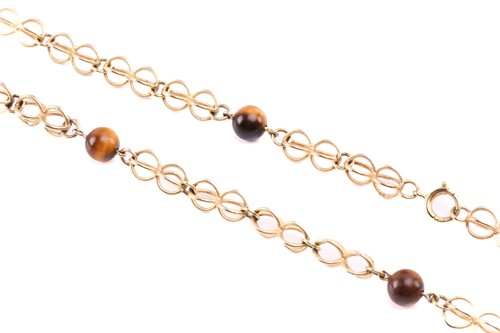 Lot 64 - A cage link necklace with tiger's eye bead...