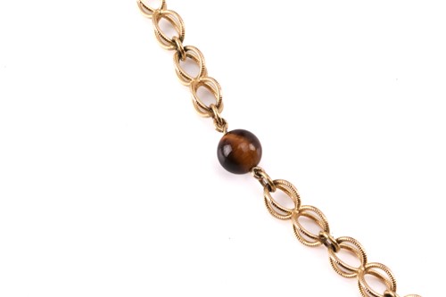 Lot 64 - A cage link necklace with tiger's eye bead...