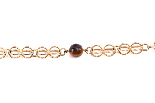 Lot 64 - A cage link necklace with tiger's eye bead...