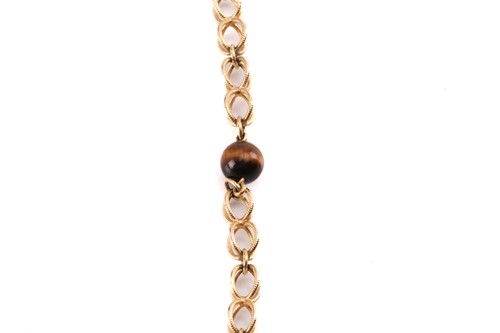 Lot 64 - A cage link necklace with tiger's eye bead...