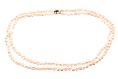 Lot 56 - A double-strand cultured pearl necklace,...