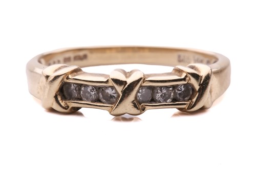 Lot 32 - A channel-set diamond ring in 14ct yellow gold,...