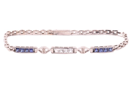 Lot 211 - A sapphire, white sapphire and diamond line...