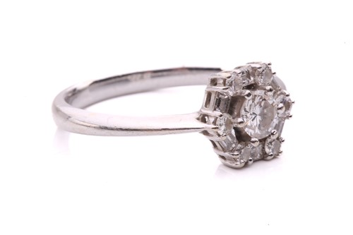 Lot 81 - A diamond cluster ring, set with a central...