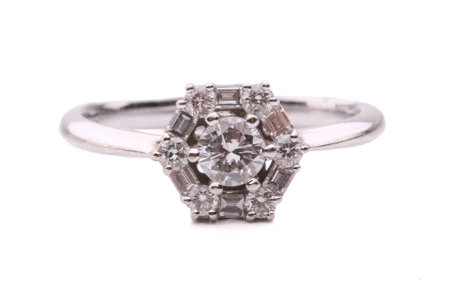Lot 81 - A diamond cluster ring, set with a central...