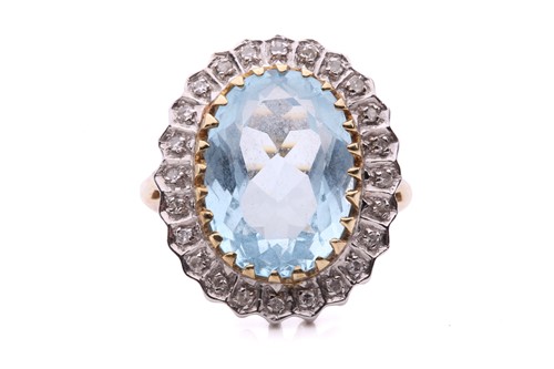 Lot 287 - A topaz and diamond cluster ring in 9ct gold,...