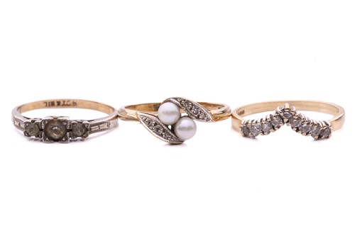 Lot 88 - A pearl and diamond cross over ring, set with...