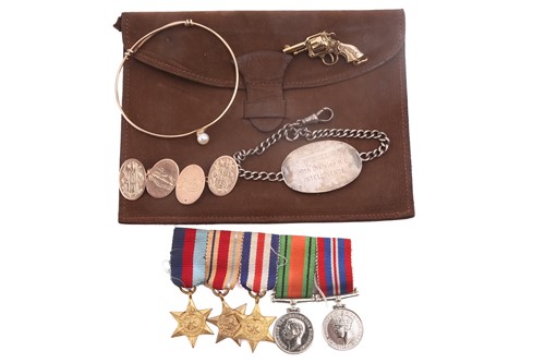Lot 251 - A small jewellery collection of military...