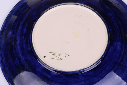 Lot 106 - A pair of Walter Moorcroft circular pottery...