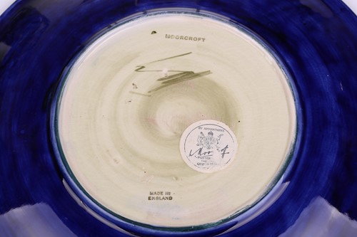 Lot 106 - A pair of Walter Moorcroft circular pottery...