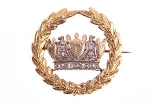 Lot 297 - A naval crown badge set with diamonds, centred...