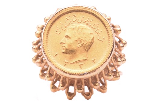 Lot 210 - A Persian coin inset signet ring, mounted with...
