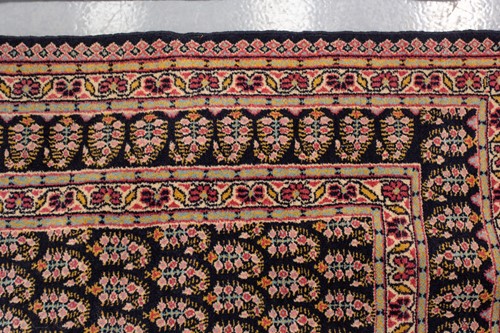 Lot 156 - A black ground Senneh rug with an allover...