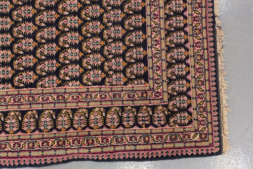 Lot 156 - A black ground Senneh rug with an allover...