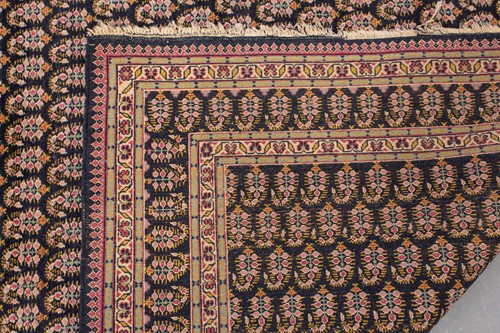 Lot 156 - A black ground Senneh rug with an allover...