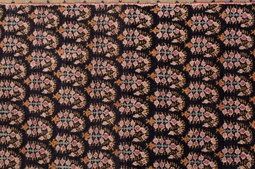 Lot 156 - A black ground Senneh rug with an allover...