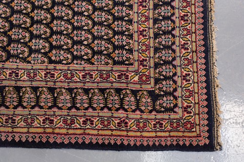 Lot 156 - A black ground Senneh rug with an allover...