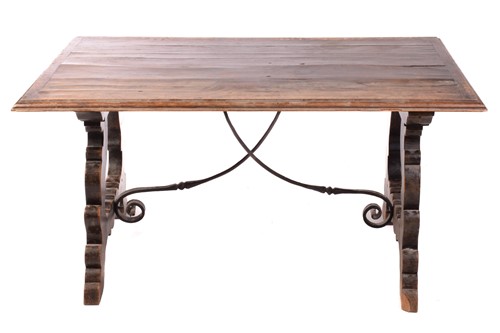 Lot 139 - A Spanish oak dining table, the associated...