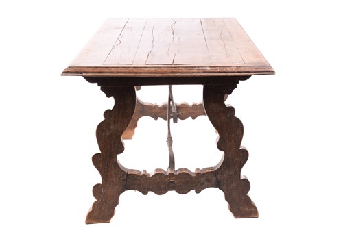 Lot 139 - A Spanish oak dining table, the associated...