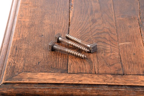 Lot 139 - A Spanish oak dining table, the associated...