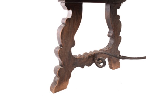 Lot 139 - A Spanish oak dining table, the associated...