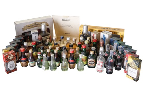 Lot 173 - An assortment of miniature bottles comprising...