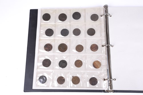 Lot 165 - An album containing a collection of coins,...