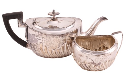 Lot 507 - A Victorian silver part-fluted teapot with...