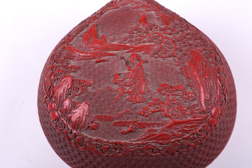 Lot 110 - A Cinnabar lacquer peach shape box, the lid...