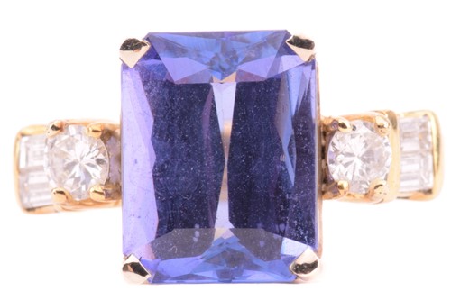 Lot 69 - A tanzanite and diamond dress ring, centred...