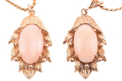 Lot 143 - Two coral-set pendants on chain together with...