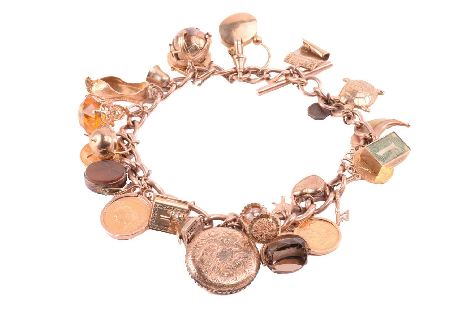 Lot 4 - A double Albert chain charm bracelet in 9ct...