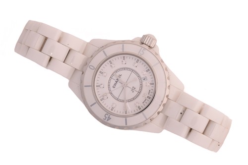 Lot 389 - A Chanel J12 white ceramic quartz wristwatch...