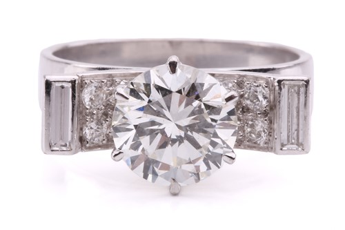Lot 303 - A diamond solitaire ring, designed as a...