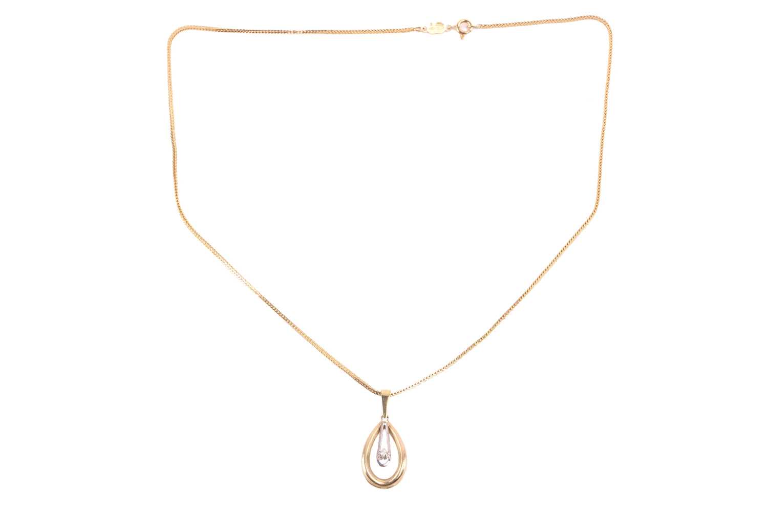 Lot 76 - A drop shape pendant set with a cubic zirconia,...
