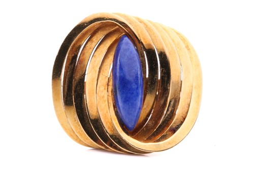 Lot 267 - A Modernist lapis lazuli cocktail ring in 18ct...