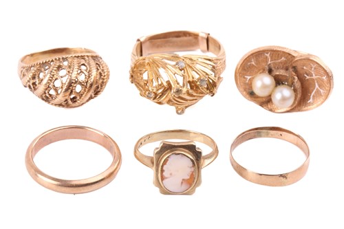 Lot 272 - A group of six dress rings; including a bombé...