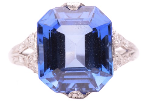 Lot 115 - A synthetic sapphire and diamond ring, circa...
