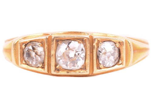 Lot 213 - A three-stone diamond half-hoop ring,...