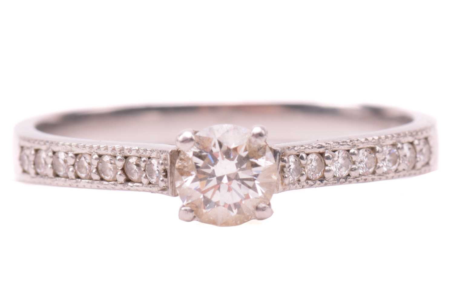 Lot 27 - A single stone diamond ring, the round...
