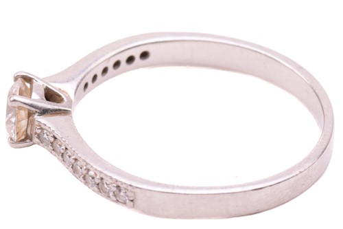 Lot 27 - A single stone diamond ring, the round...