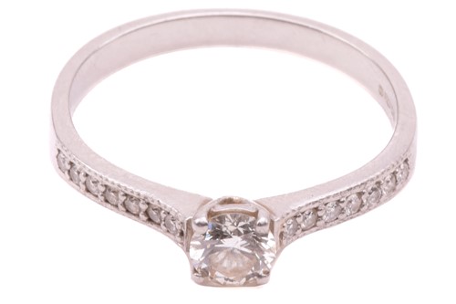 Lot 27 - A single stone diamond ring, the round...