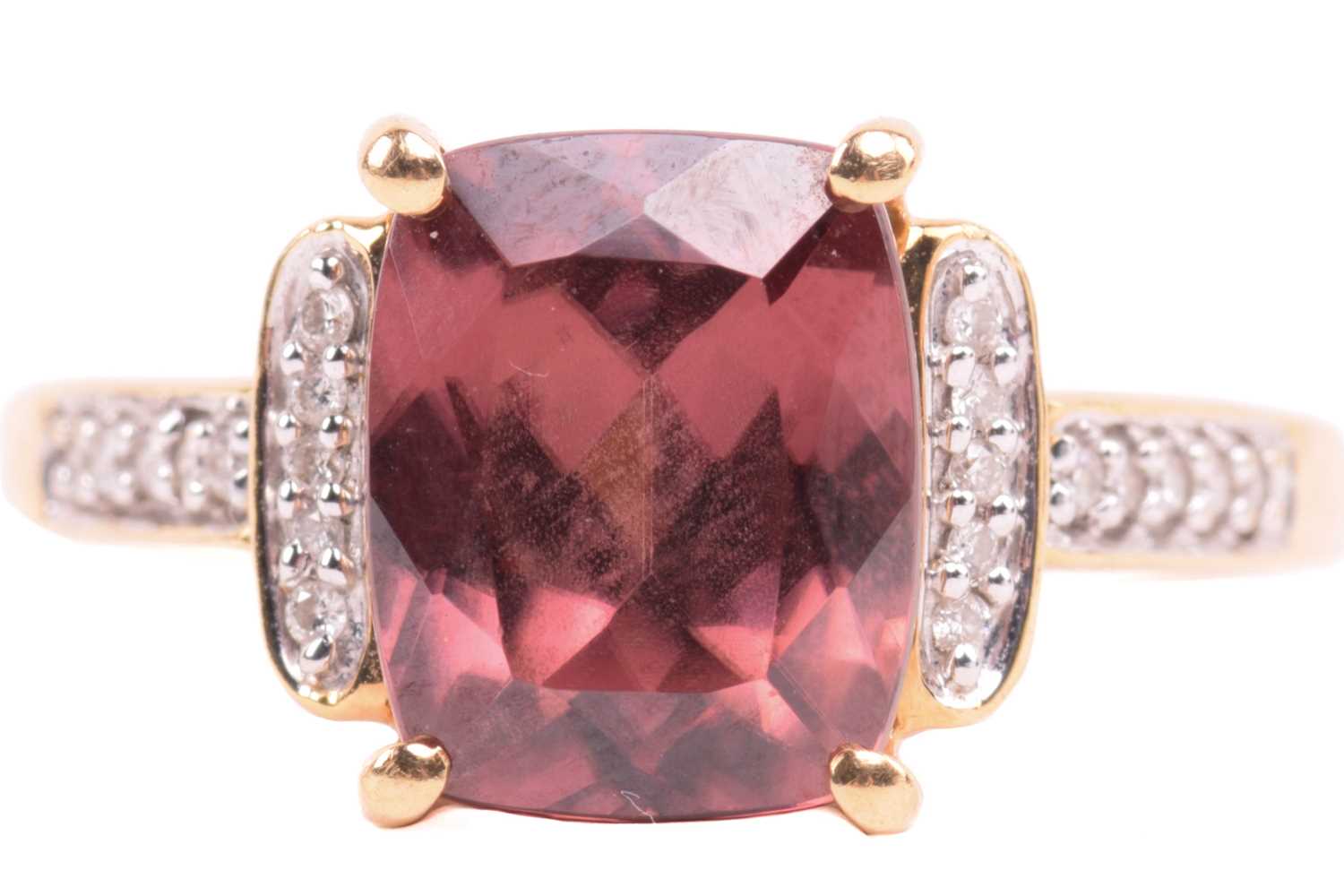 Lot 52 - A red zircon and diamond dress ring in 18ct...