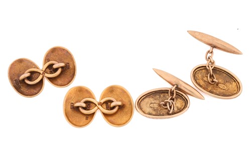 Lot 33 - Two pairs of gold cufflinks; a plain oval pair...