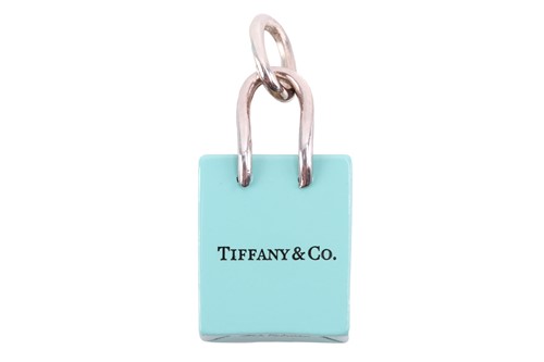 Lot 48 - Tiffany & Co. - a shopping bag charm with...