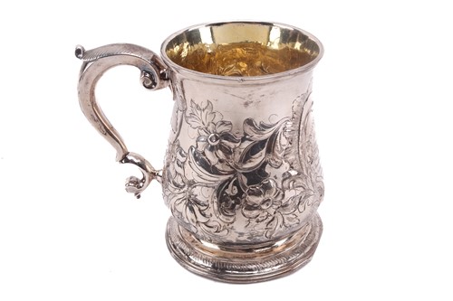 Lot 474 - An 18th century silver mug with later...