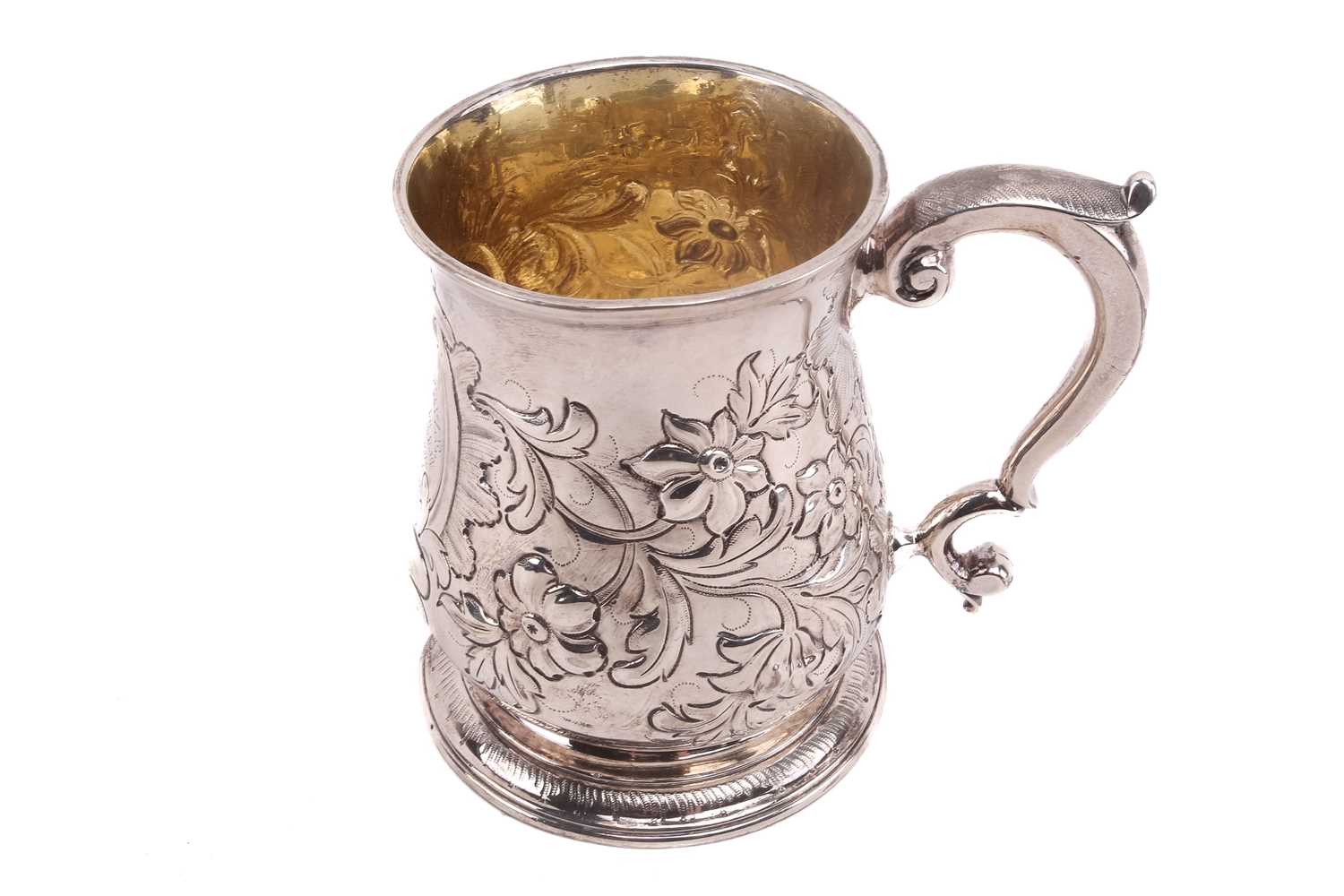 Lot 474 - An 18th century silver mug with later...