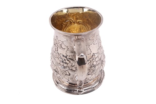 Lot 474 - An 18th century silver mug with later...