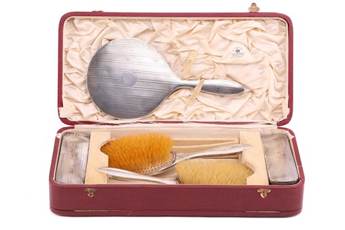 Lot 533 - A Mappin and Webb silver dressing set in its...